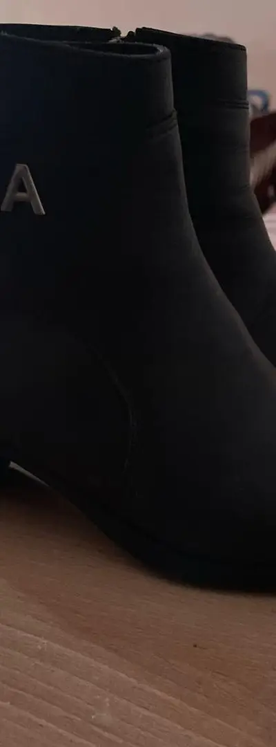 Bottes à talons en cuir noir en bon état