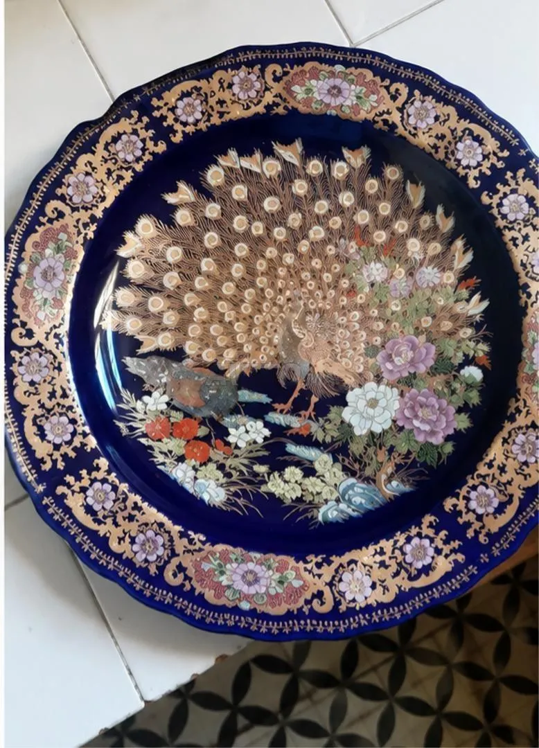 Plat en plumes de paon authentiques neuf