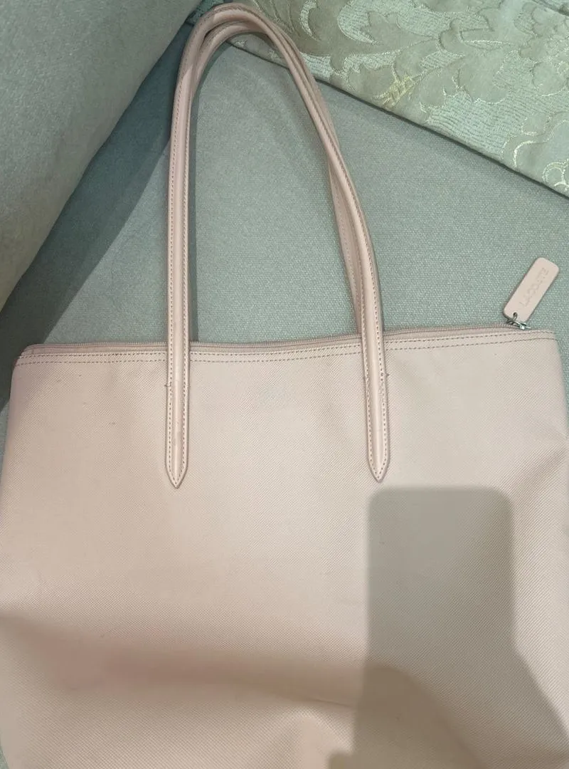 Sac Lacoste rose bon état